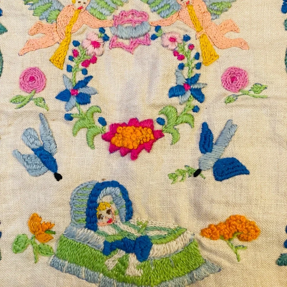 Beautiful small sampler of newborn child, knitted in colorful needlework linen